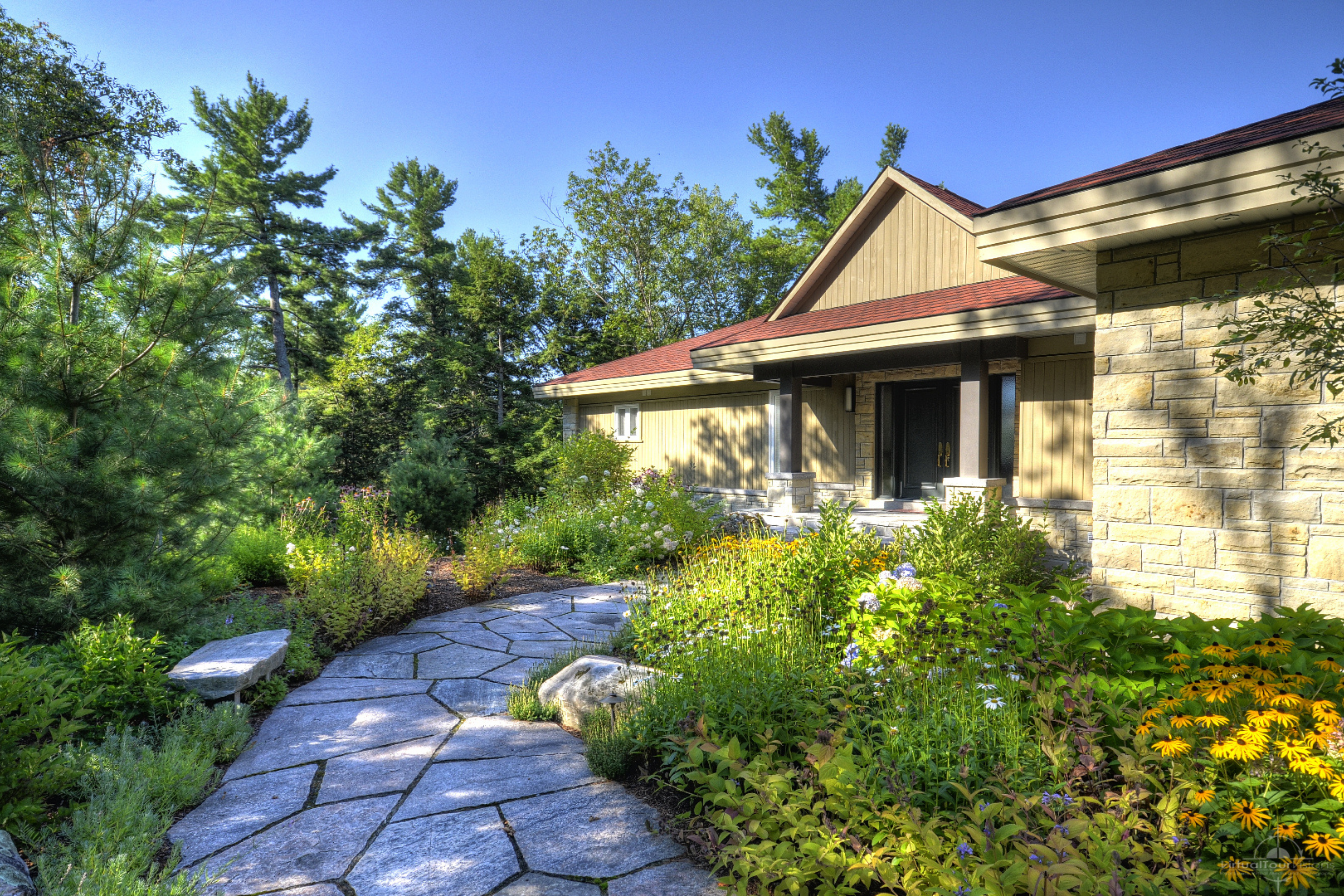 Cottage garden design ideas using garden structures, trellises, and vertical planting for height.