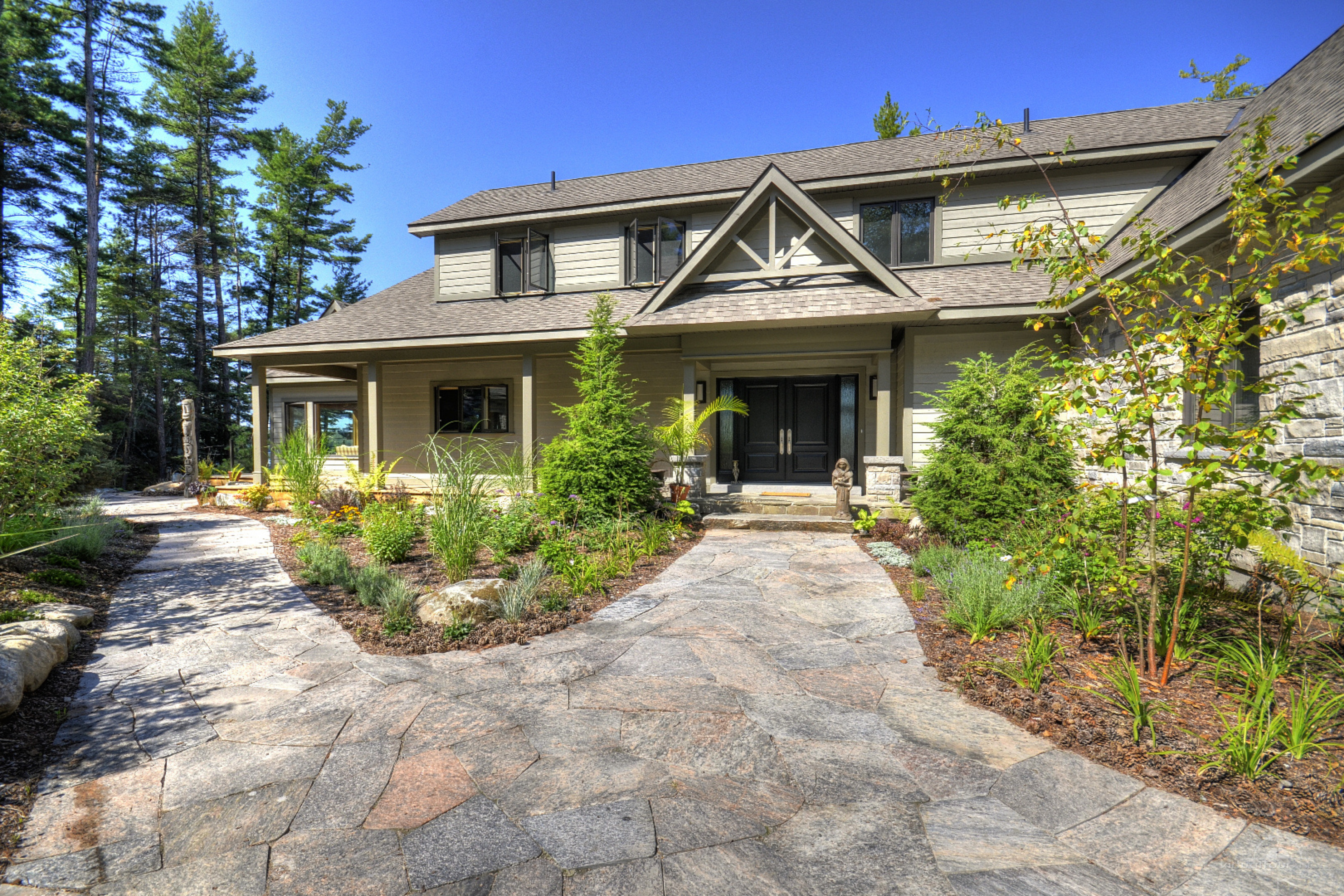 Cottage garden design ideas with informal layouts and meandering stone paths for a natural flow.