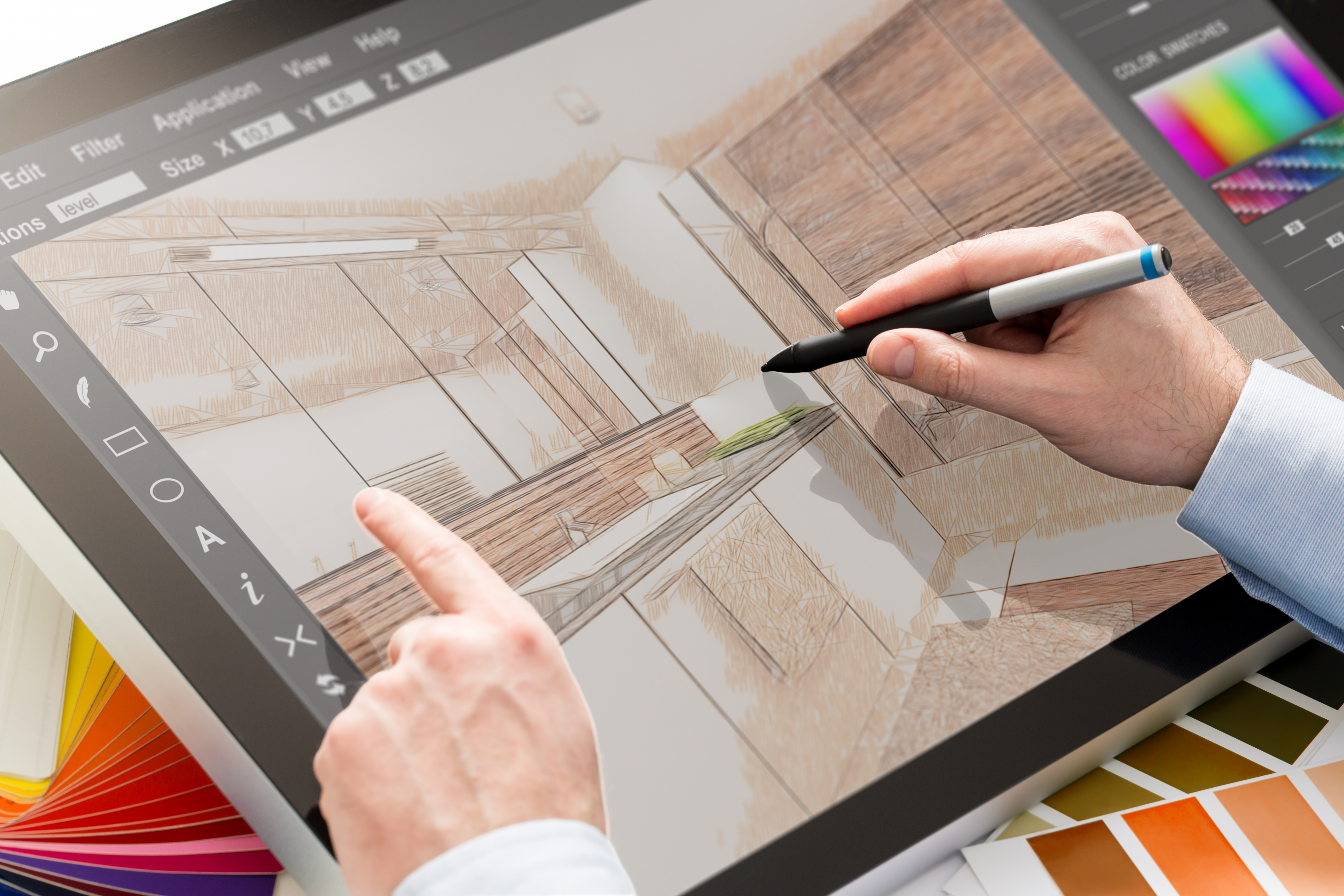Architect creating detailed floor plans as part of the process of building a custom cottage.